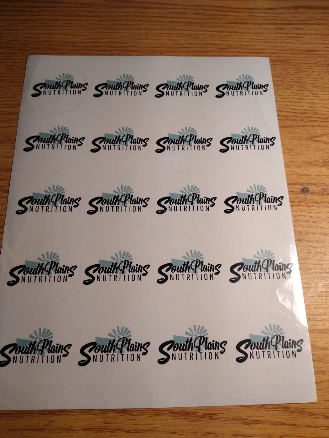 A sheet of round logo stickers